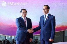 Thủ tướng Chính phủ Phạm Minh Chính gặp Tổng thống Indonesia Joko Widodo - Ảnh: VGP