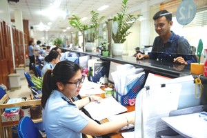 Luật Quản lý thuế (thay thế) có mục tiêu cắt giảm thời gian xử lý thủ tục hành chính, giảm chi phí tuân thủ pháp luật cho người nộp thuế. Ảnh: Nhã Chi