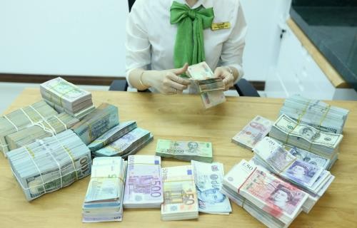 Tỷ giá USD hôm nay tăng 2 đồng. Ảnh minh họa: BNEWS/TTXVN