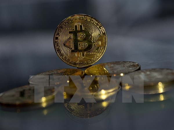 Đồng tiền Bitcoin tại London, Anh ngày 20/11. (Nguồn: AFP/TTXVN)