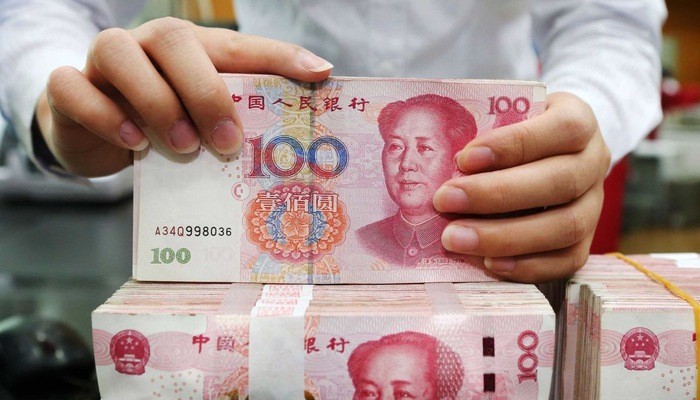 Ngày 5/8, tỷ giá Nhân dân tệ so với đồng USD sụt dưới ngưỡng quan trọng 7 tệ đổi 1 USD, thấp nhất 1 thập kỷ - Ảnh: CNN.