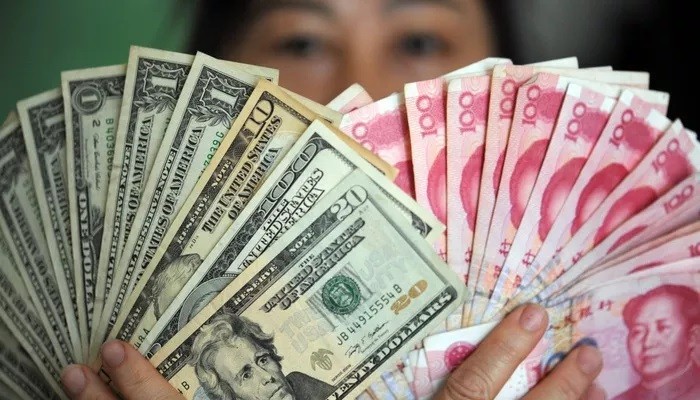 Từ tháng 8 tới nay, Nhân dân tệ đã giảm giá 2,78% so với USD - Ảnh: Xinhua/SCMP.