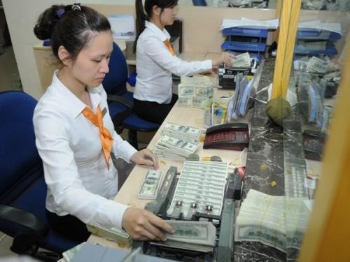 Giá USD tại Vietcombank hôm nay 16/1 tăng 10 đồng. Ảnh: TTXVN