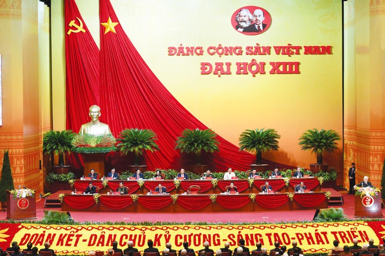 Tổng Bí thư, Chủ tịch nước Nguyễn Phú Trọng trình bày báo cáo của Ban Chấp hành Trung ương Đảng khóa XII về các văn kiện trình Đại hội. Ảnh: Quý Bắc