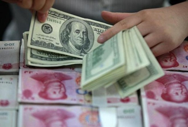 Khối nợ lớn là một trong những nguyên nhân khiến NDT được dự báo yếu đi. Ảnh:Reuters