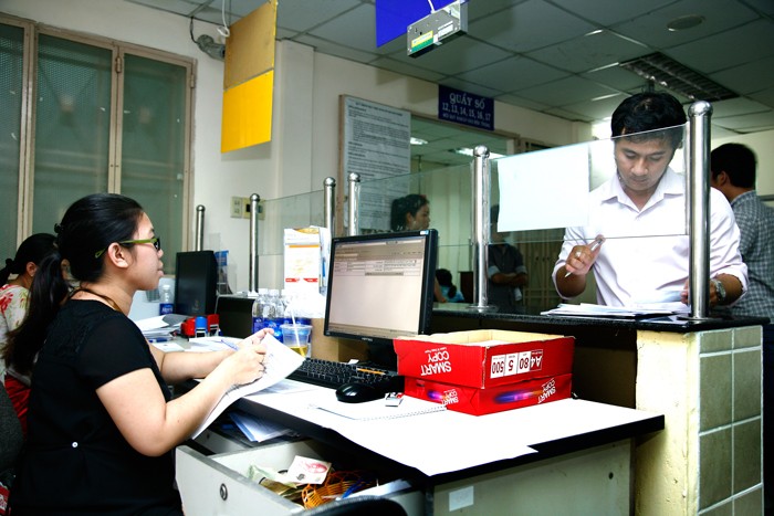 Cần cơ chế liên thông trong giải quyết thủ tục liên quan đến đăng ký đầu tư và đăng ký doanh nghiệp. Ảnh: Lê Tiên