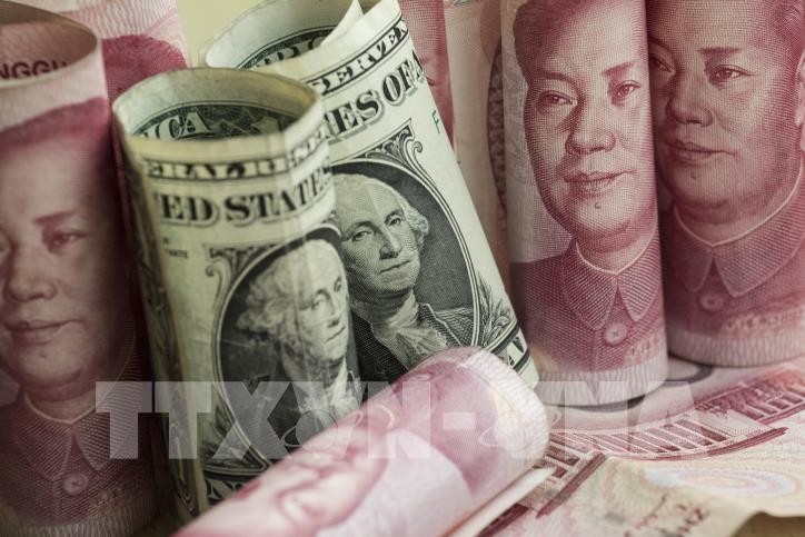 Sáng nay giá USD giảm mạnh và giá đồng Nhân dân tệ (NDT) biến động nhẹ. Ảnh: TTXVN phát