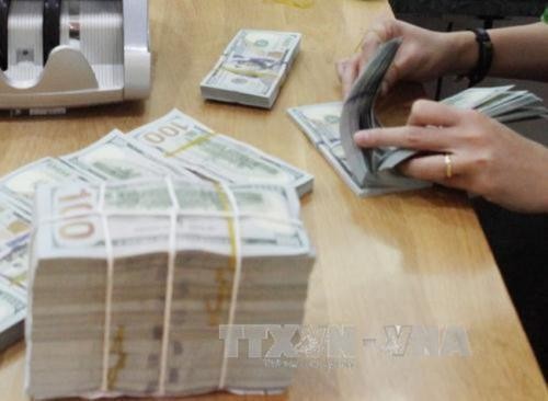 Tỷ giá trung tâm giảm 4 đồng. Ảnh minh họa: TTXVN